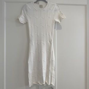 White fitted mini dress. Torn by Ronny Kobo. Fitter lining. Size S.